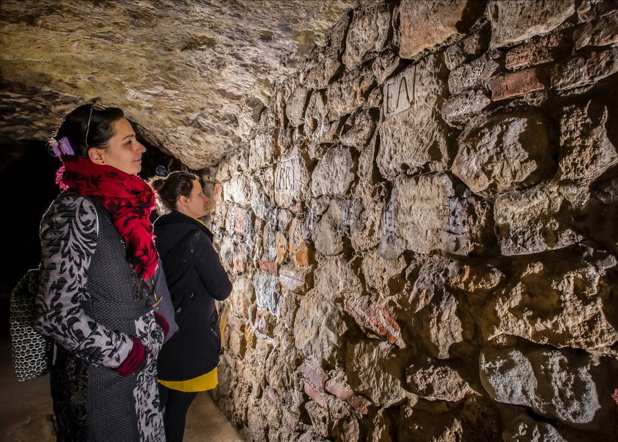Budapest: Buda Castle Cave Tour - The time-travel storyline: wine cellars, medieval prison, and WWII bomb shelters